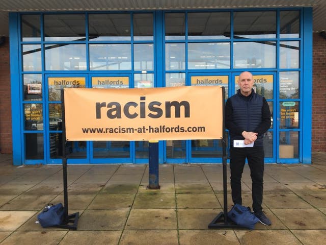<p>Alan Wainwright protesting out of Halfords in Chester </p>